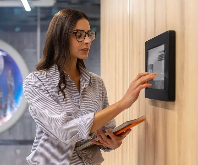 GBE Group Automation Systems girl touching automation wall panel
